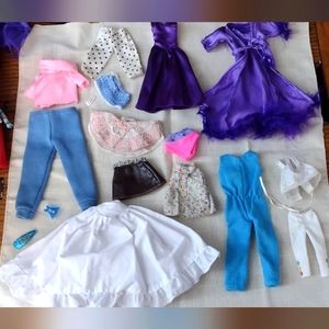 Lot of 13 pieces of barbie clothes and additional accessories.